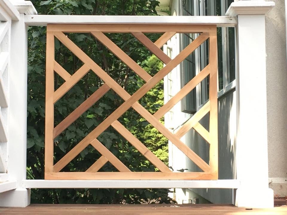 Custom cedar Chippendale-style deck railing built by Uncle Dino Construction