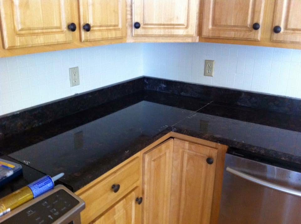Kitchen with wood cabinets and granite countertops