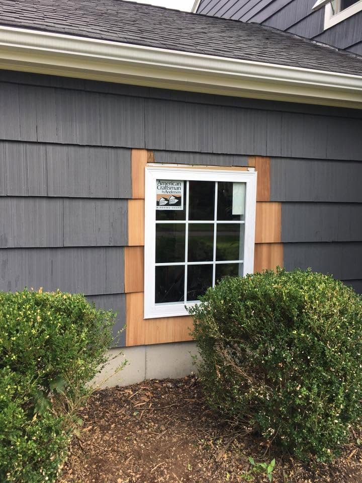 New window with custom wood trim by Uncle Dino Construction